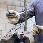 Worker braids end of the steel wire rope slings.